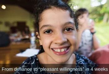 Young girl looking into camera. Text: From defiance to &ldquo;pleasant willingness&rdquo; in 4 weeks.