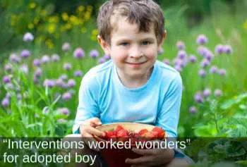 Smiling boy with a bowl of cherries. Text: &ldquo;Interventions worked wonders&rdquo; for adopted boy