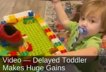 Young boy playing with Legos. Text: Video&mdash;Delayed toddler makes huge gains.